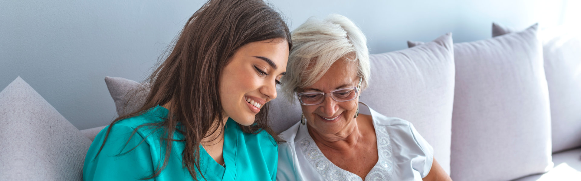 Elderly woman in nursing home and nurse